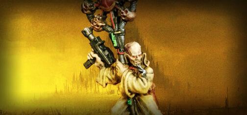 Fotografía de una miniatura de Necromunda. Un pistolero clásico de metal dramatis personae. Es un tipo pálido calvo, con barba de chivo canosa, vestido con un abrigo largo de color arena, que empuña una autopistola y un báculo tecnológico con un ojo en el ápice, rodeado de un círculo de cableado metálico y cráneos de bronce.