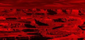 Imagen del planeta Ashum, del universo de Warhammer 40k Roleplay. Es un terreno baldío, formado por grandes riscos y quebradas por grandes torrentes de agua en la antigüedad pero que a día de hoy está completamente seco. Lo baña la luz rojiza de su estrella.