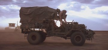 Un carro ushamita. Un vehículo de cuatro ruedas, cochambroso, construido a base de chatarra y piezas incoherentes de diferentes otros vehículos de procedencia más que dudosa. La clase de vehículo habitual en planetas de baja tecnología dentro del universo de Warhammer 40000 Roleplay Dark Heresy, como Usham,
