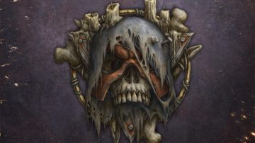 Una calavera mugrienta con un antifaz de metal tachonado y oxidado que, a su vez, está cubierto por un trozo de tela rasgado que se sostiene sobre el casco con unos clavos que atraviesan la frente. Sobre la parte de arriba del cráneo tiene una vela a medio derretir, como las hay también detrás sostenidas por una triángulo equilátero de metal oxidado con la base arriba, que se superpone a un círculo de huesos. El alimento de las leyendas de Necromunda.