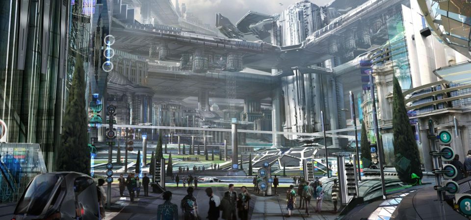 Ilustración concept art para el remake de Total Recall del año 2012. Muestra, desde el nivel de la calle, una panorámica de las calles de una ciudad, sus edificios y varios niveles de pasarelas entre ellos tan amplias que pueden usarse como paseos o avenidas. Predominan los colores grises, que contrastan con ocasionales verdes de cierta vegetación vestigial. Ésta podría ser una escena habitual en aventuras de Walküre.